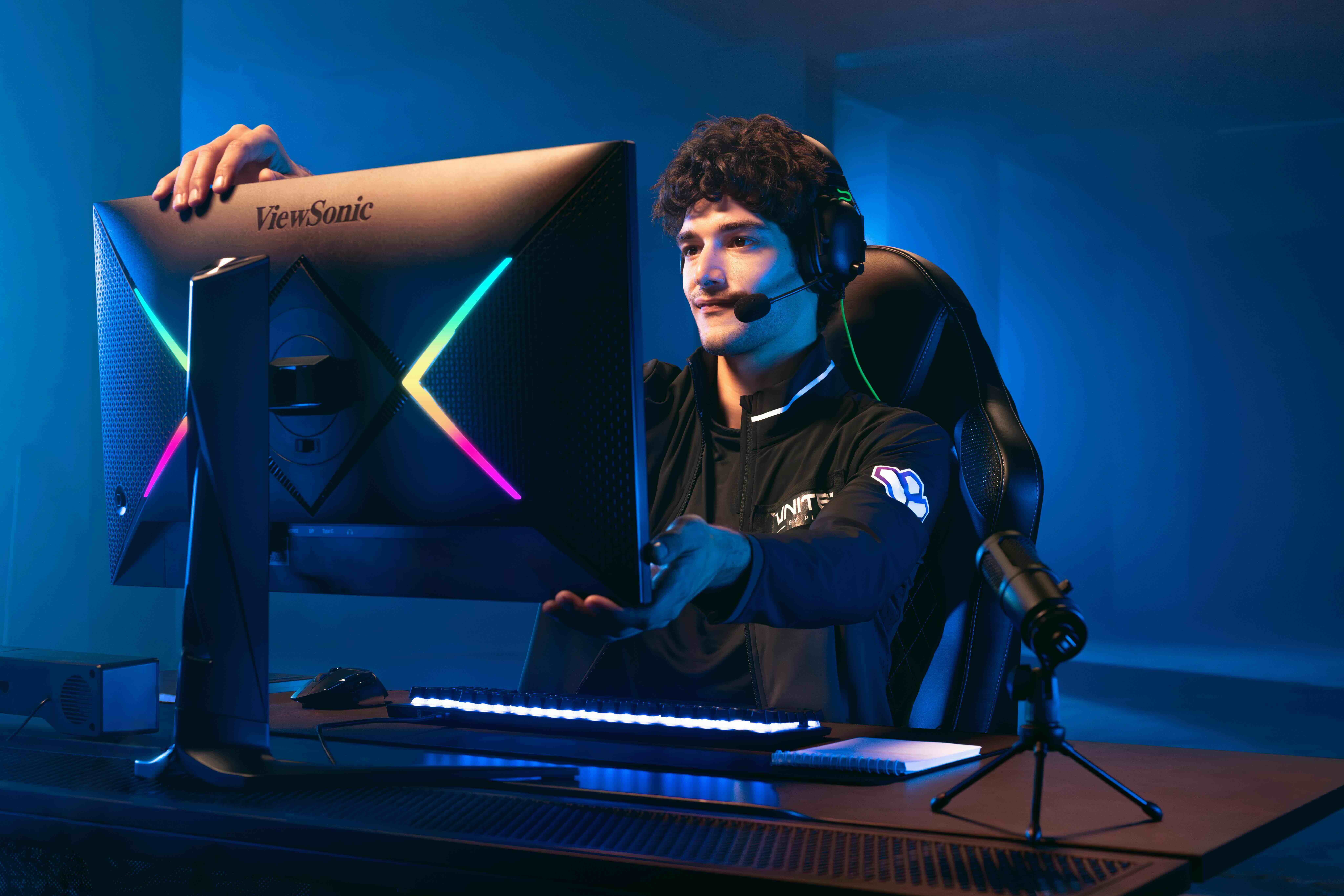 Gamer with high refresh rate esports monitor.