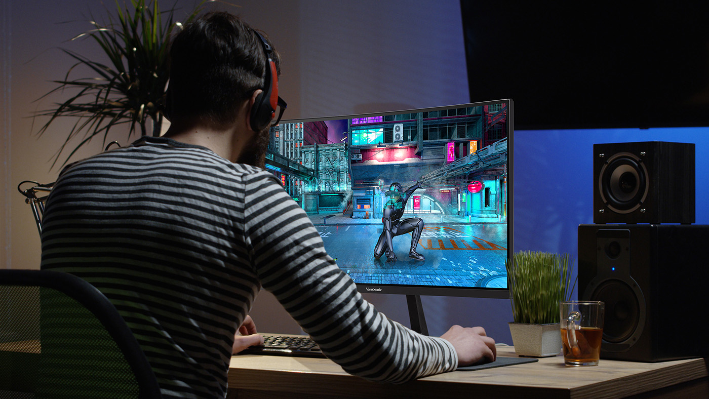 Man playing a video game on a ViewSonic Gaming monitor