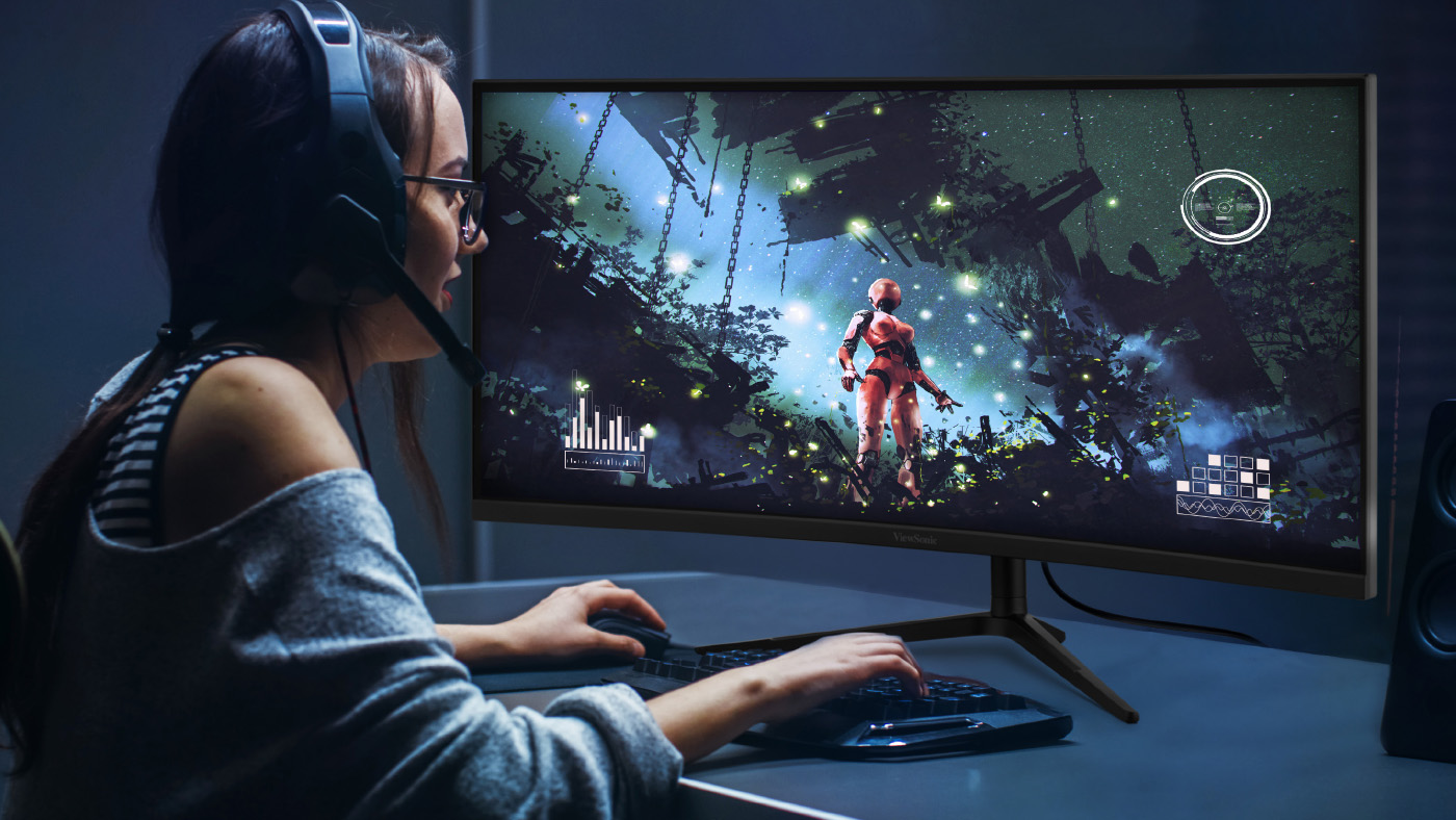 Gamer enjoying immersive gaming with a ViewSonic monitor.