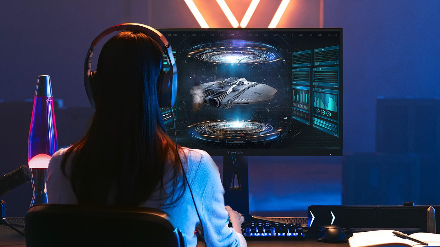 Gamer looking at spaceship on ViewSonic monitor.