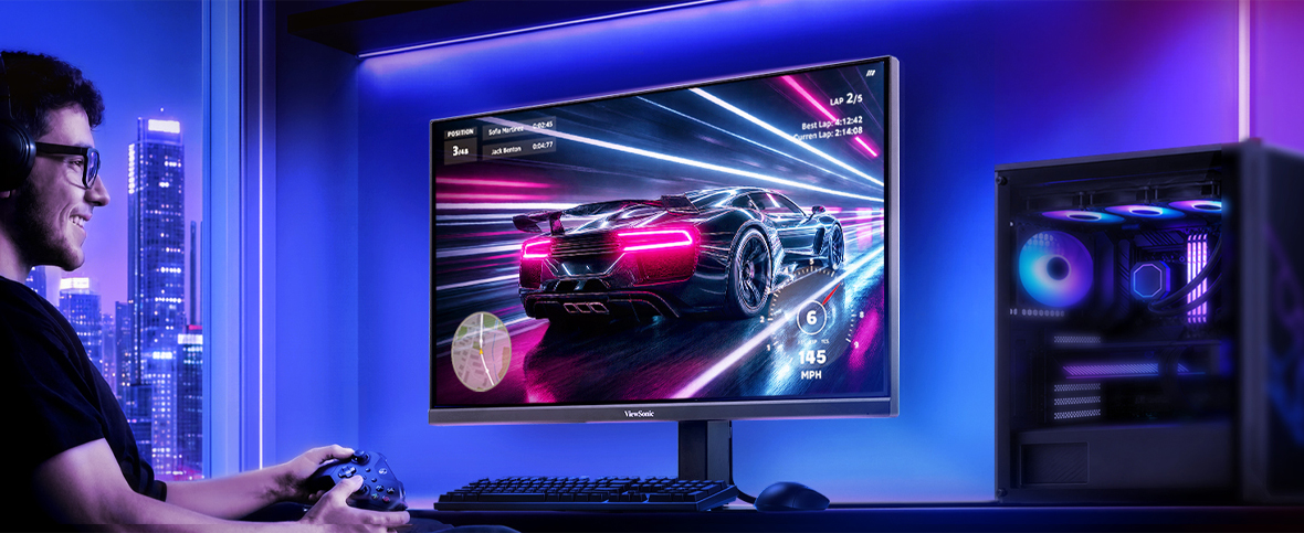 someone sitting at a desk playing a computer game
