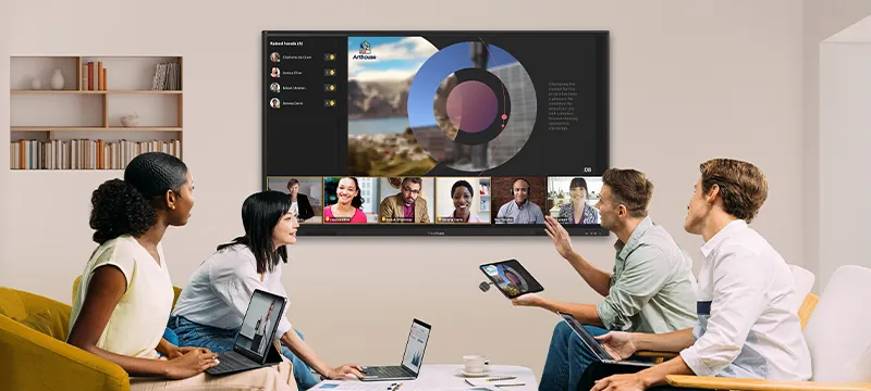an LCD with people in a meeting