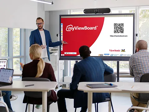 a teacher giving a presentation to their coworkers through the use of a viewboard