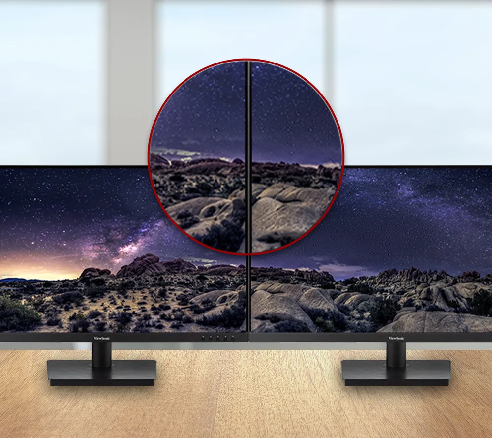 two monitors side by side witch a close up of the narrow space between the two