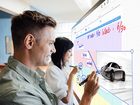 two coworkers simultaneously using the touch feature of a viewboard display