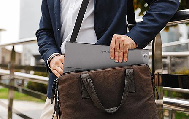Employees at a conference table using a ViewBoard to meet with remote employees 