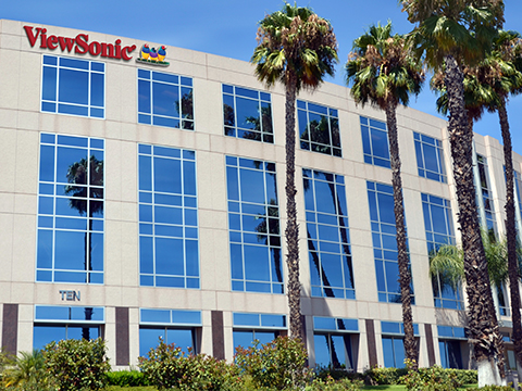 Woman sitting at a desk working on her computer