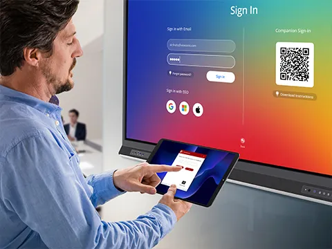 someone wirelessly connecting a display