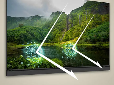 a man working on a laptop connected to a variety of displays with the software