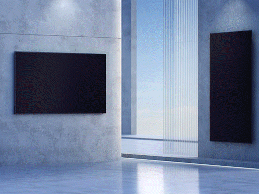 a reception desk with large format screens on the walls