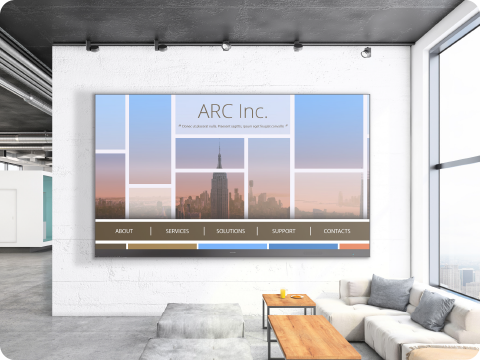 two screens on the wall of a conference room