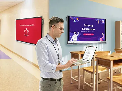 someone on a laptop connecting to three different display types