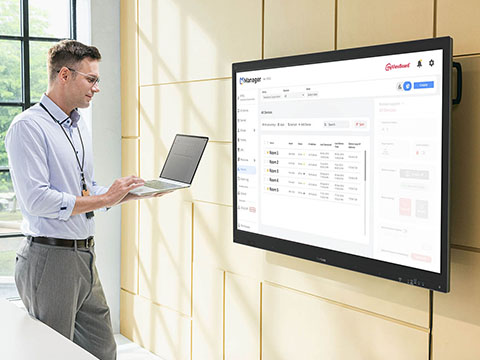 two people using the touch screen on a viewboard simultaneously.