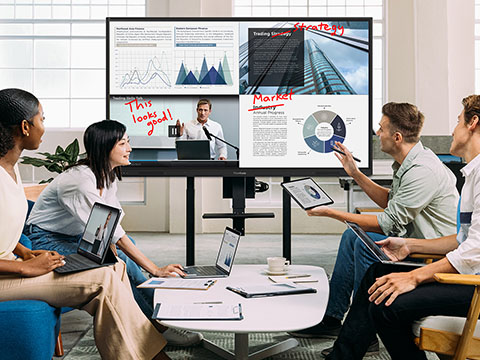 two people using the touch screen on a viewboard simultaneously.