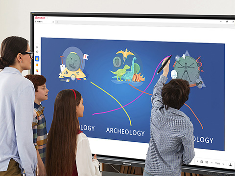 Group of 3 students at a ViewBoard completing a science exercise while a teacher looks on