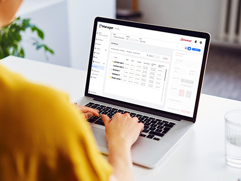 IT person using ViewSonic Manager to control a variety of ViewBoards within a campus