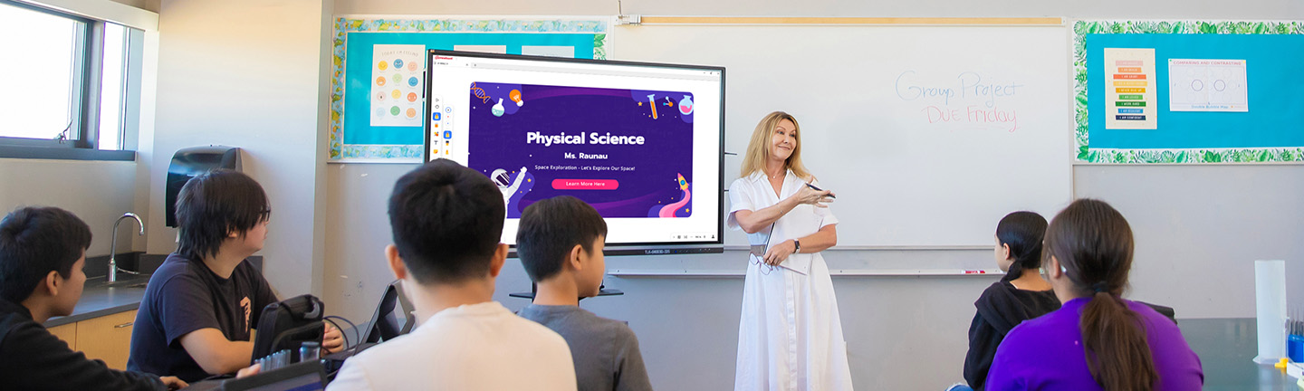 Teacher using a ViewBoard to help instruct a class of junior high or high school students