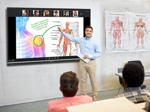 Instructor teaching to both a classroom of students and remote students
