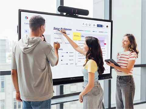 Teacher teaching a classroom from a podium using the ViewSonic ID2456-4K