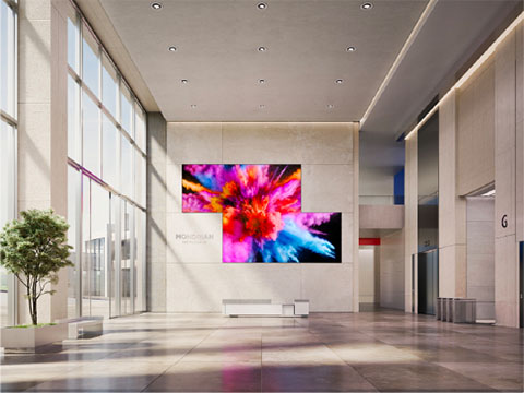 Instructor teaching to a classroom and hybrid students shown on the screen