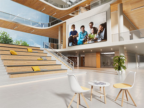 Teacher teaching a classroom from a podium using the ViewSonic ID2456-4K