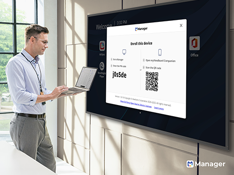 a man connecting wirelessly to a large display using a pairing code