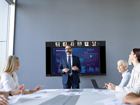 a man giving a presentation in a conference room