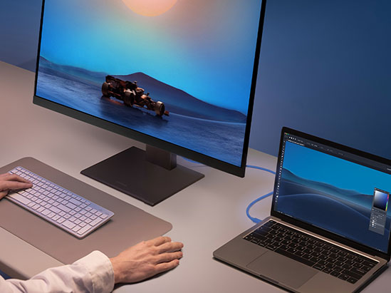 a laptop connected to a monitor with a single cable