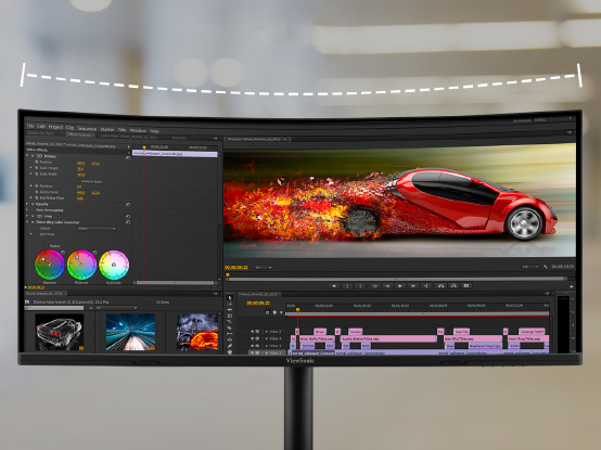 a man using photo editing software on an ultrtrawide display