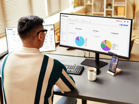 a man using photo editing software on an ultrtrawide display