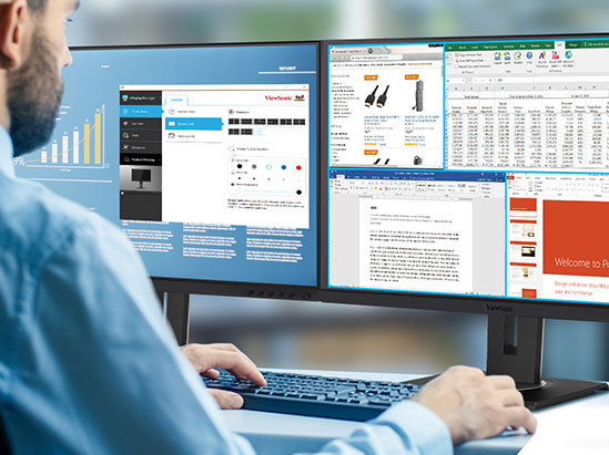 a man working on a dual monitor setup