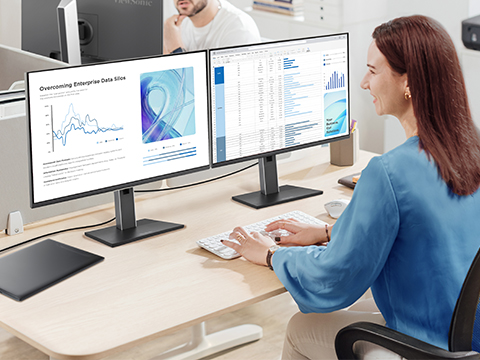 A dvLED display in a meeting room showing content and remote participants.
