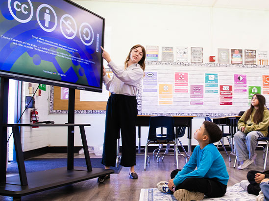 a teacher in front of a classroom.