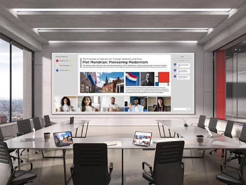 A dvLED display in a meeting room showing content and remote participants.