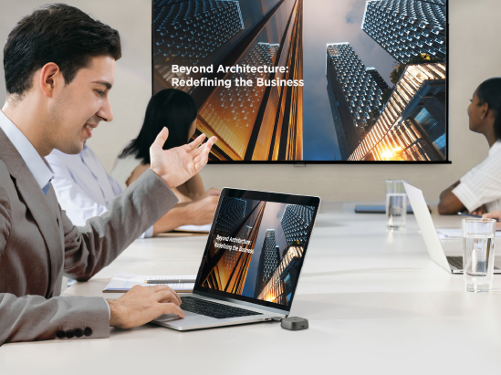 a man wirelessly connects to an LED display from his laptop