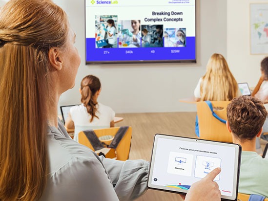 a male instructor teaching using a digital podium