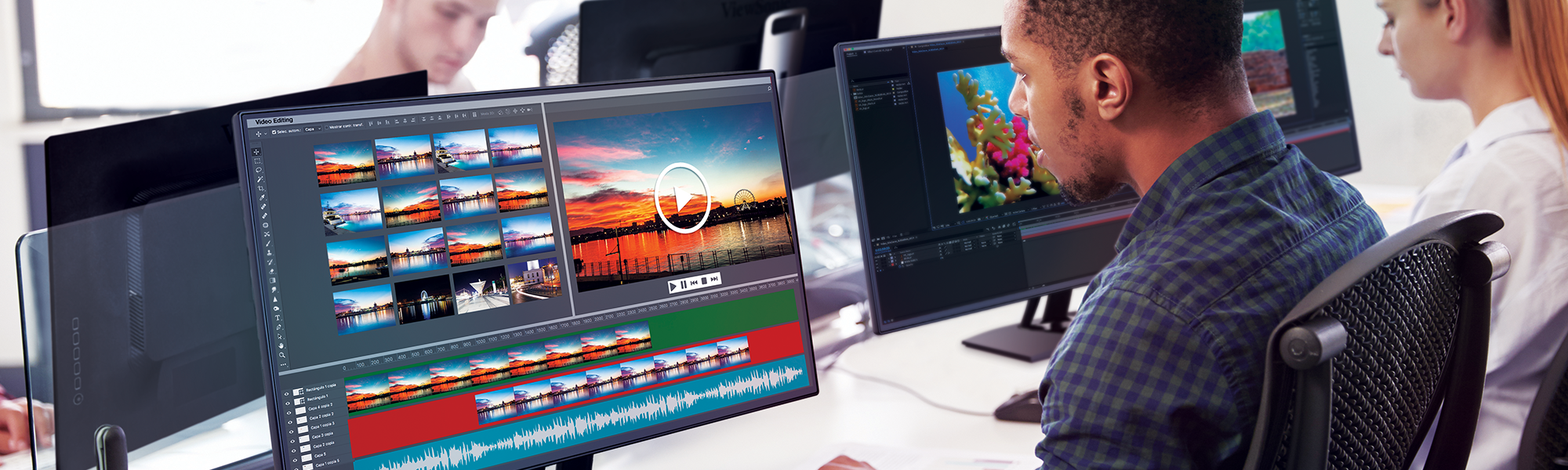 students raising their hands with a monitor in the foreground