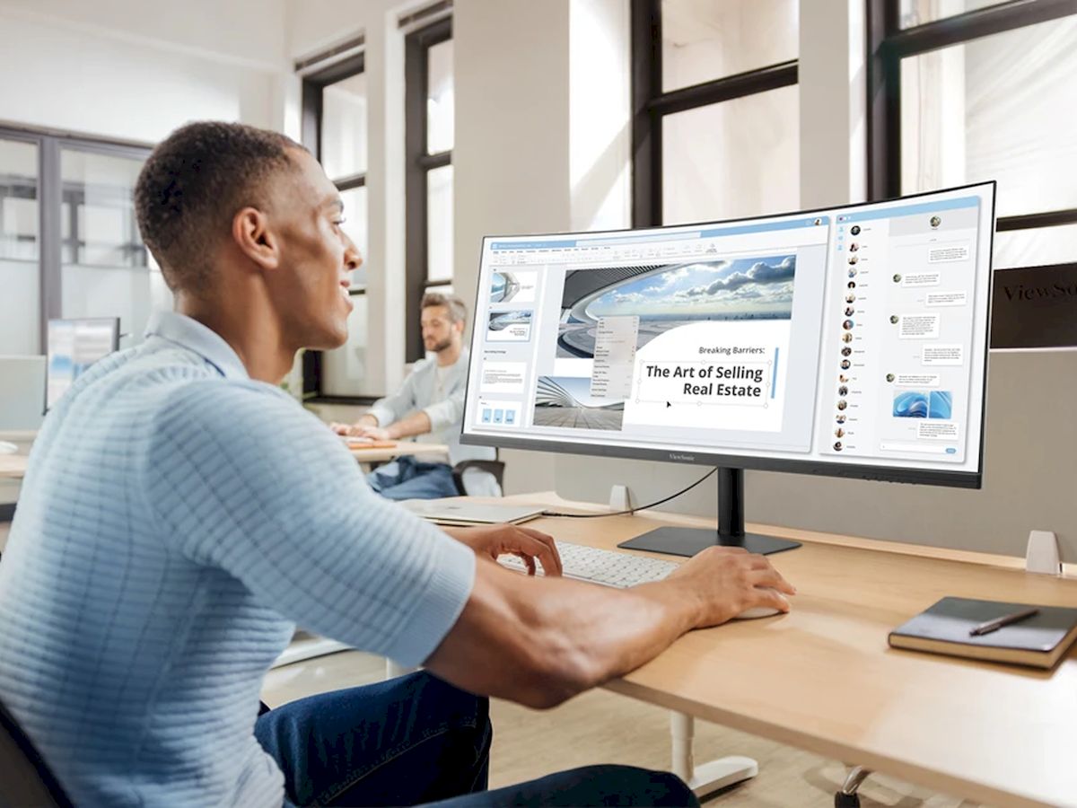 Büroumgebung mit einem ViewSonic Ultrawide-Monitor zur Unterstützung effizienter Arbeitsabläufe und Dokumentenverwaltung.