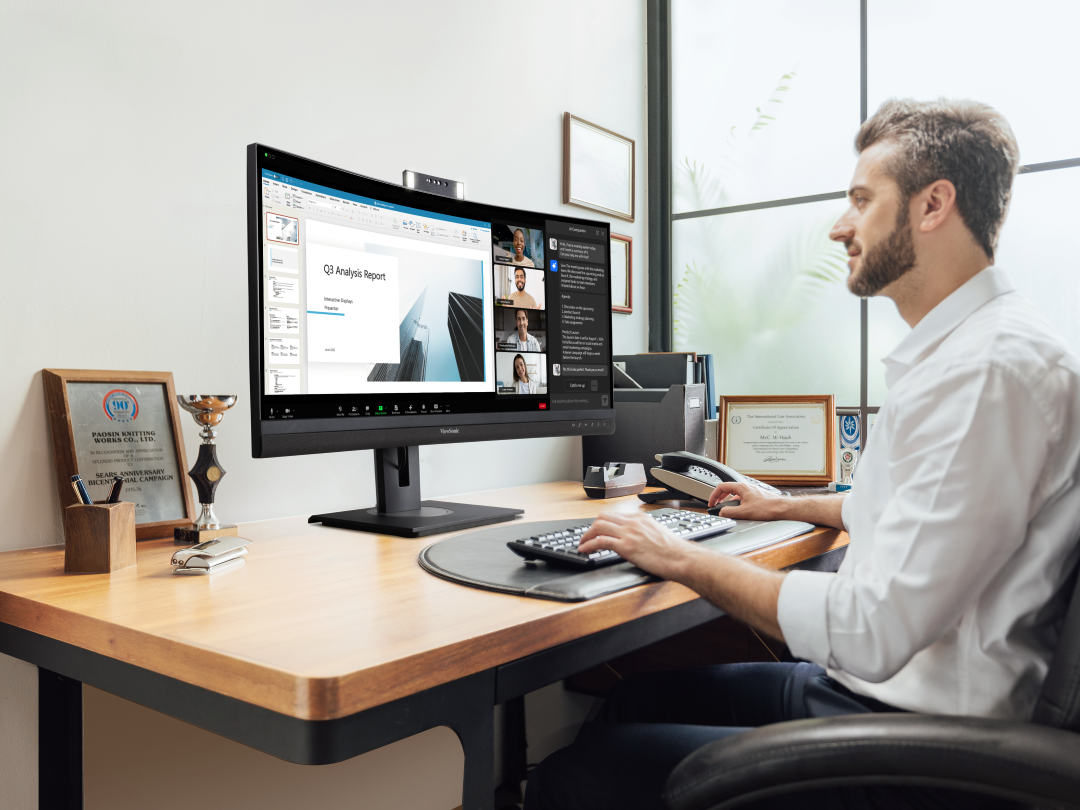 A 21:9 video conferencing docking monitor offers an immersive meeting experience with an expanded view for content and seamless AI software integration, enhancing productivity.