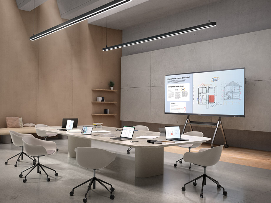 Team members wirelessly sharing content in a meeting.