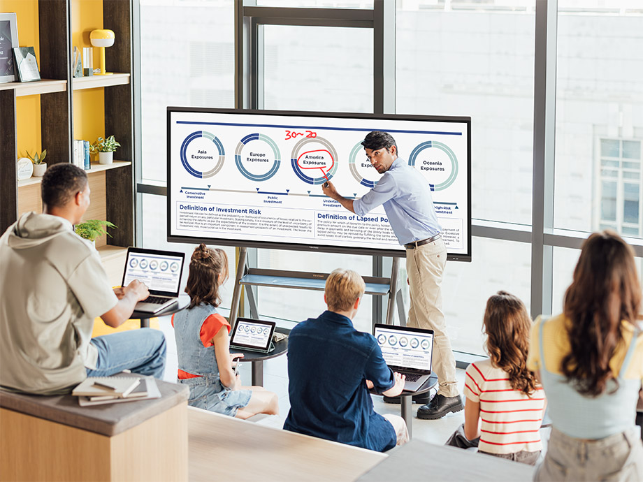 Employees attending corporate training with visual aids.